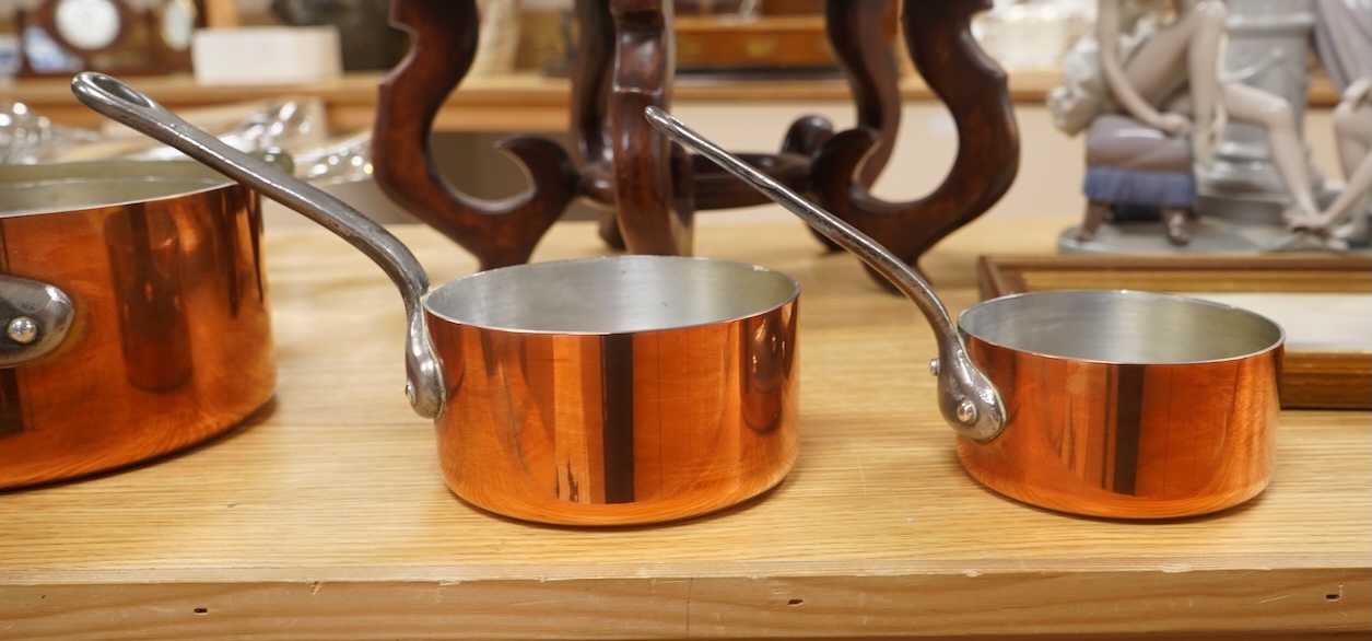 A set of five French graduated iron handled copper saucepans, largest 18.5cm diameter. Condition - good